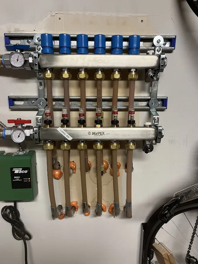 Plumber performing Water Heater Repair at a residential property in St. Augusta